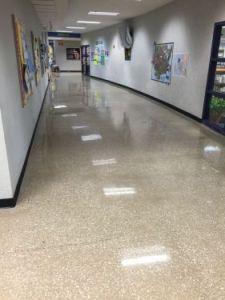 exposed aggregate and polished concrete floor school hallway